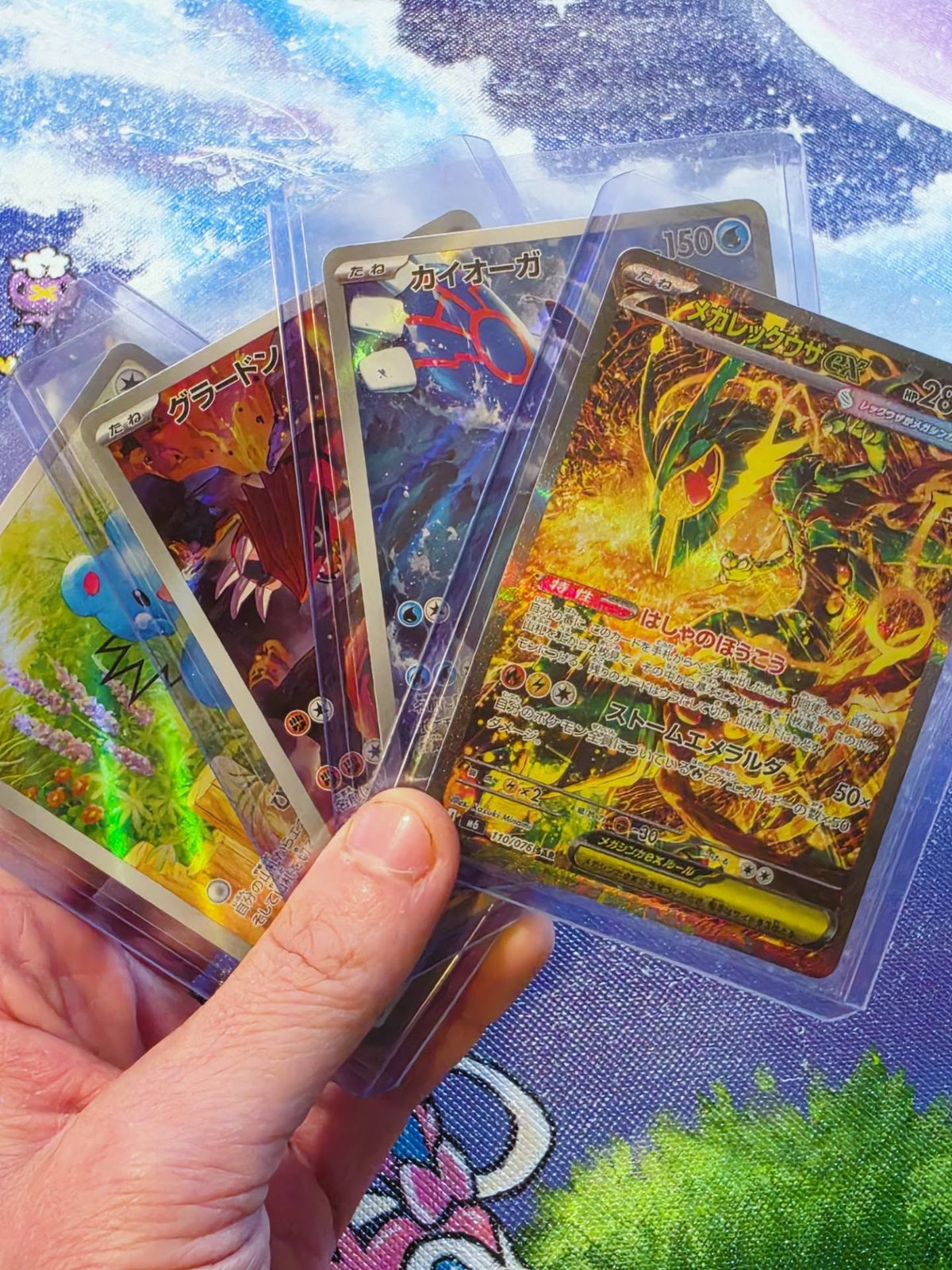 Pokémon Special Art Rare (SAR) cards shown next to a custom toploader binder by 5/14 Apparel — built for Pokémon, Magic, Dragon Ball Z, and Yu-Gi-Oh! collectors