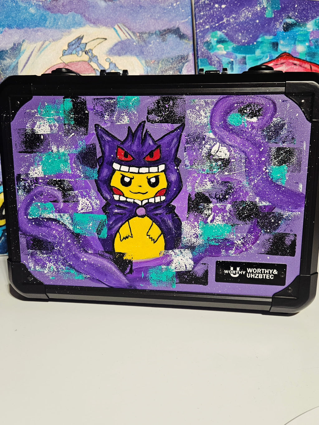 Front view of custom hand-painted Poncho Gengar limited quantity 3-row slab case — Pikachu wearing a Gengar poncho with purple tentacles and teal galaxy swirls on purple background, freehand acrylic artwork by 5/14 Apparel