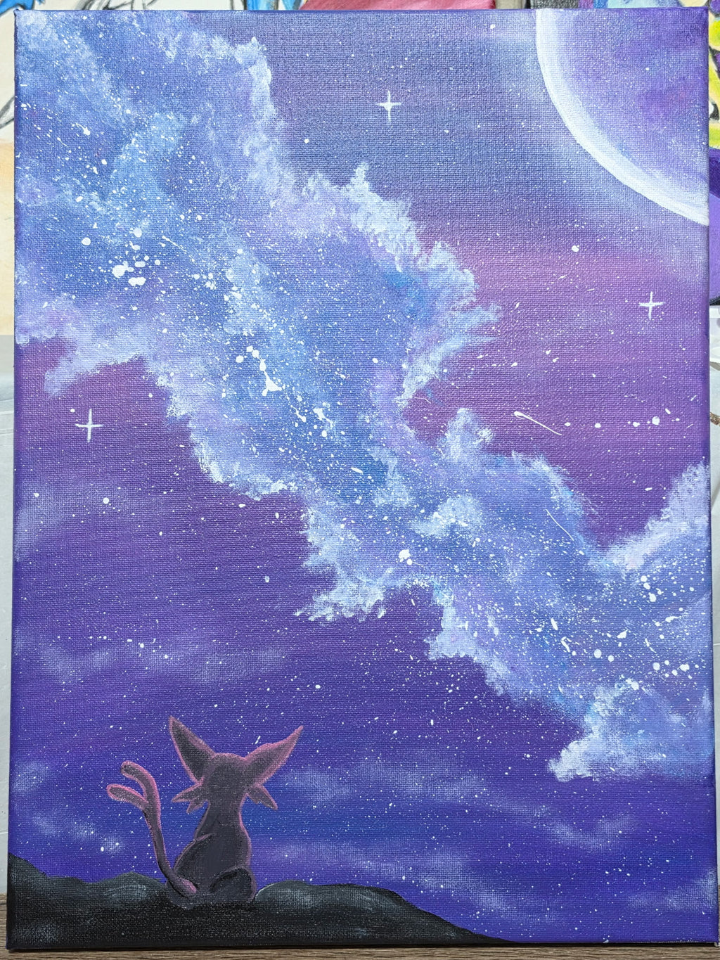 Hand-painted Espeon galaxy canvas — Espeon sitting on a dark hilltop gazing up at a sweeping purple and blue galaxy sky with swirling star clouds and crescent moon. 1 of 1 original acrylic art by 5/14 Apparel.