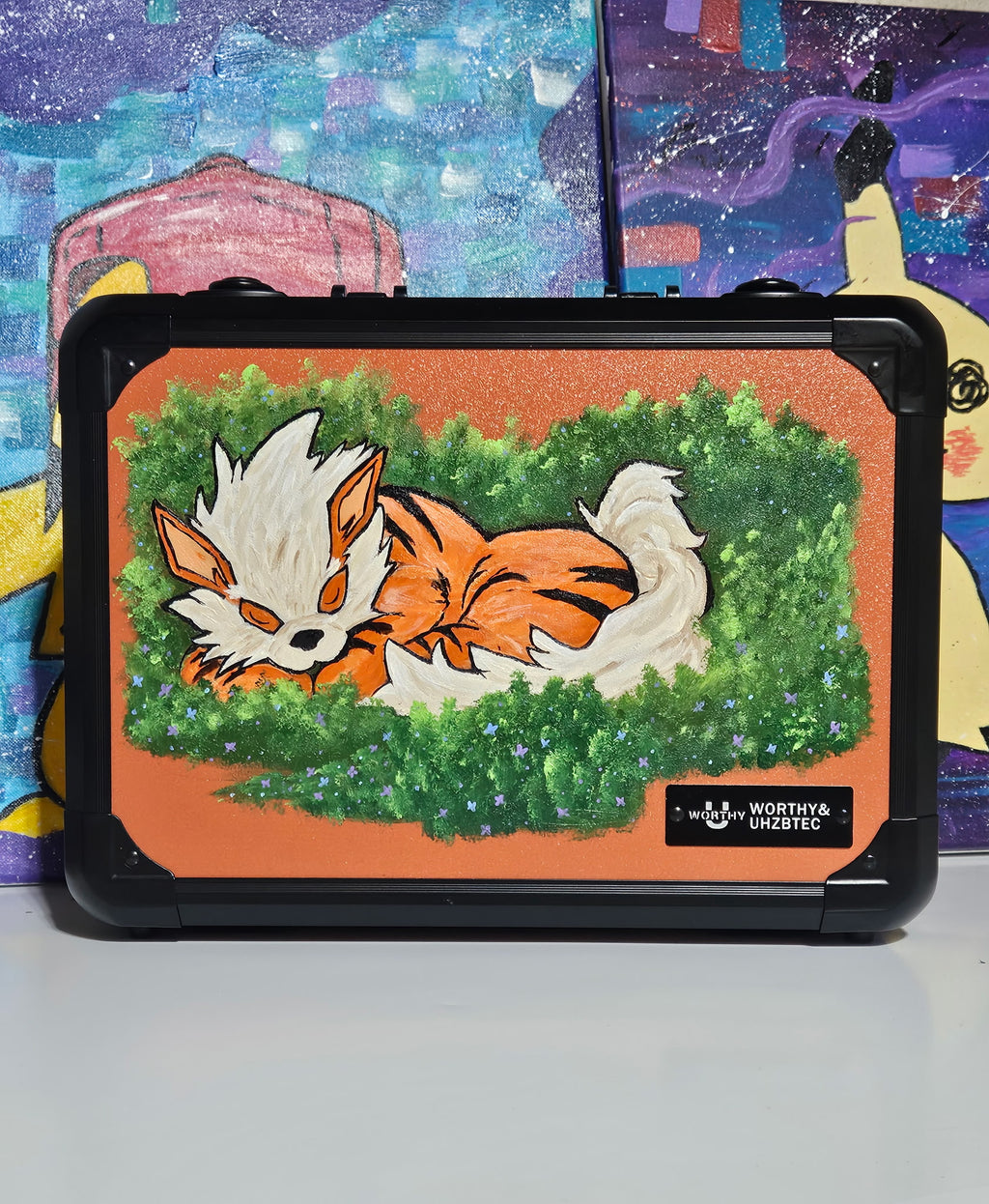 Front view of custom hand-painted Arcanine 3-row slab case — orange and cream Arcanine mid-stride with bold black flame markings on orange background, freehand acrylic artwork by 5/14 Apparel