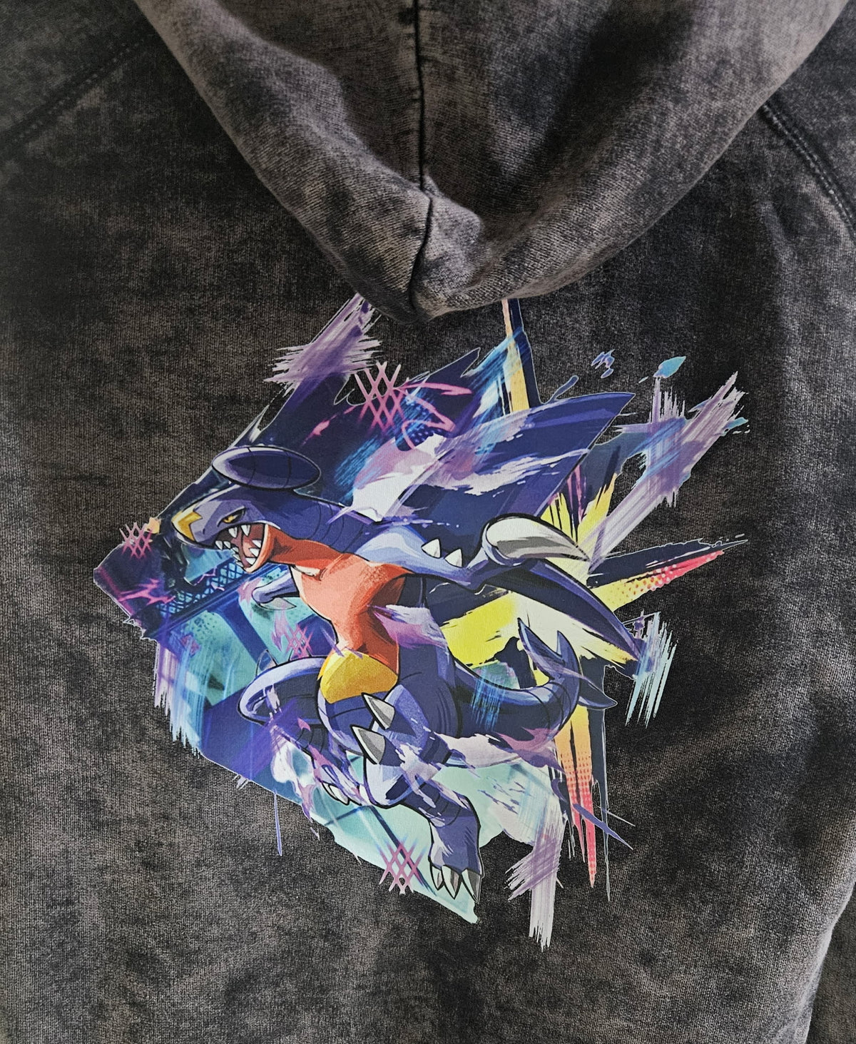 Close-up of Garchomp graphic on mineral wash black hoodie — dynamic Garchomp full back design by 5/14 Apparel