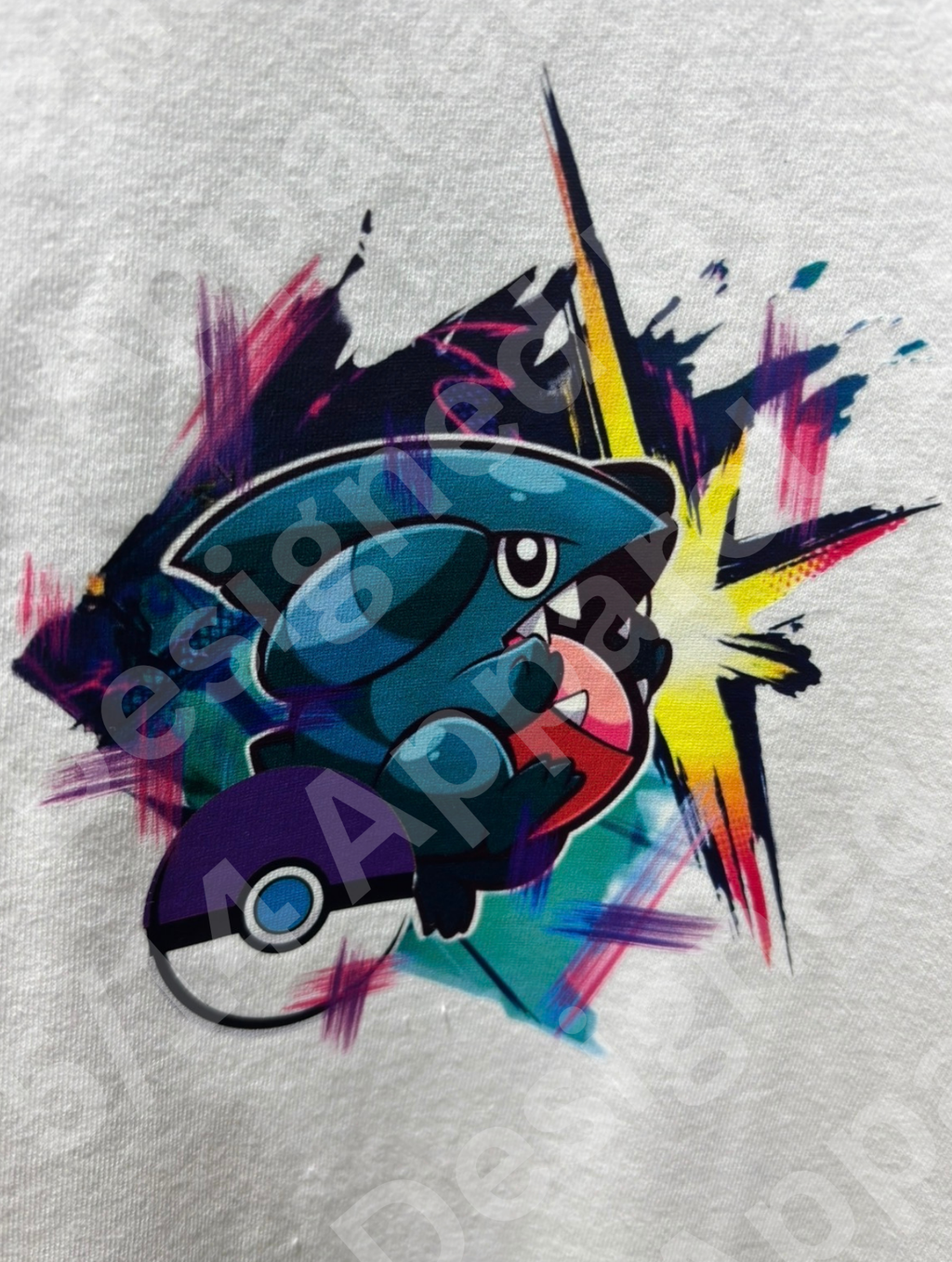 Close-up of the Gible and Garchomp graphic artwork printed on the tee