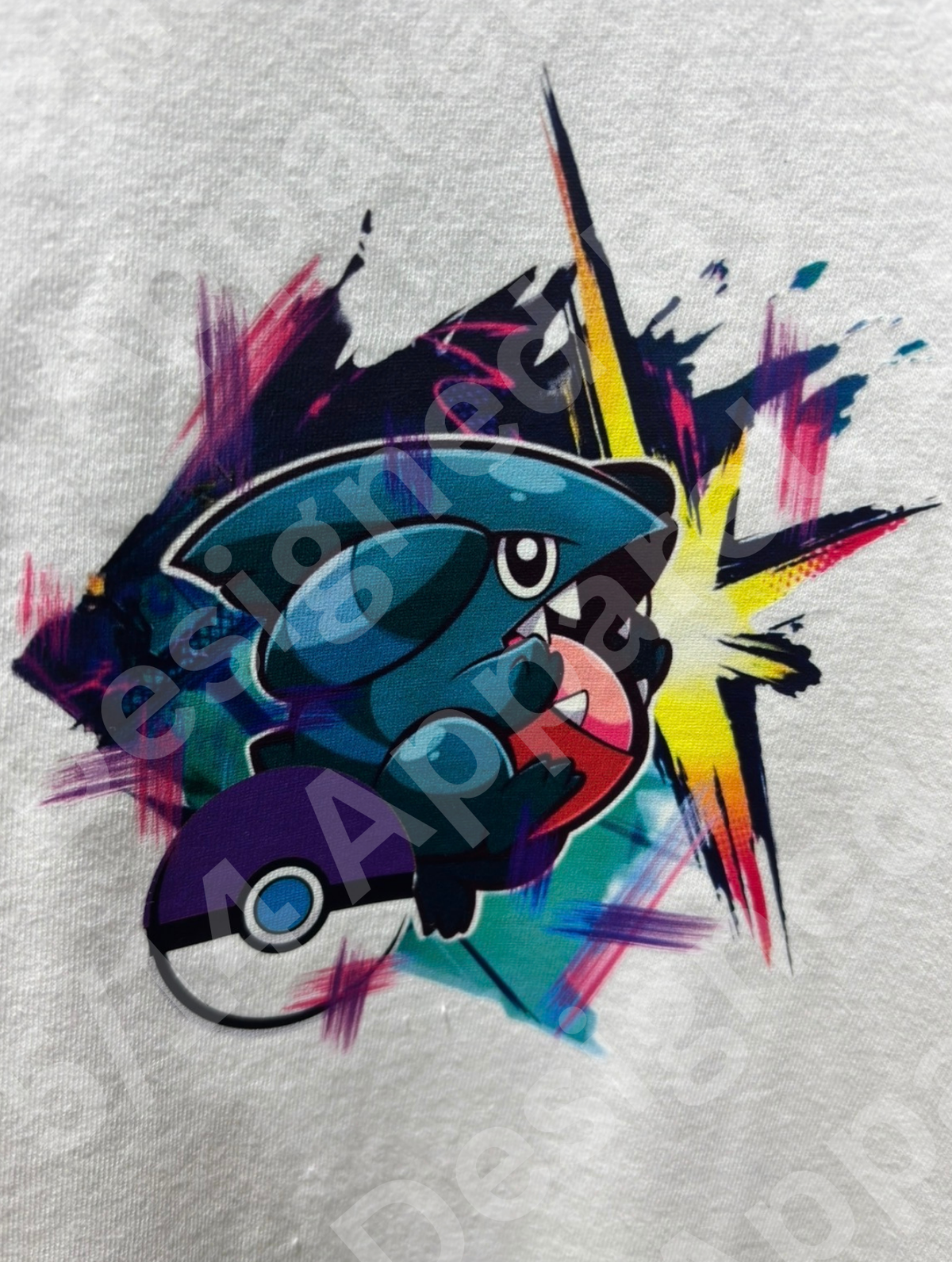 Close-up of the Gible and Garchomp graphic artwork printed on the tee