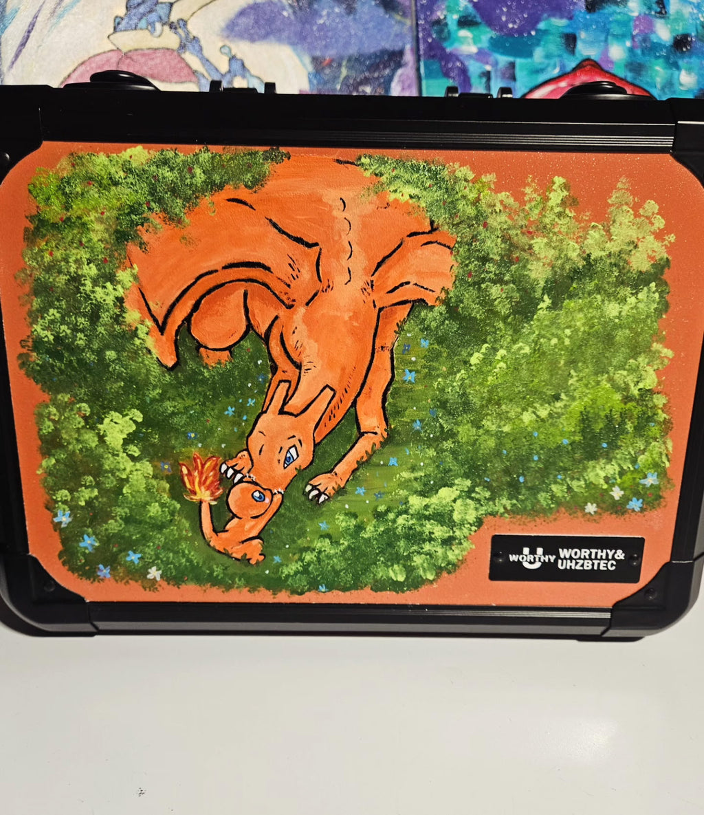 Front view of custom hand-painted Charizard limited quantity 3-row slab case — orange Charizard diving through lush green treetops with flame tail on orange background, loving charmander freehand acrylic artwork by 5/14 Apparel