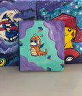 Front view of custom hand-painted Dratini Poncho binder — Dratini wearing a Dragonite poncho floating through purple clouds on teal background, freehand acrylic artwork by 5/14 Apparel