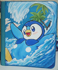 5/14 Apparel custom hand-painted Piplup 9-pocket top loader binder — Piplup surfing ocean wave with palm tree island background, one-of-one acrylic art on vibrant teal binder