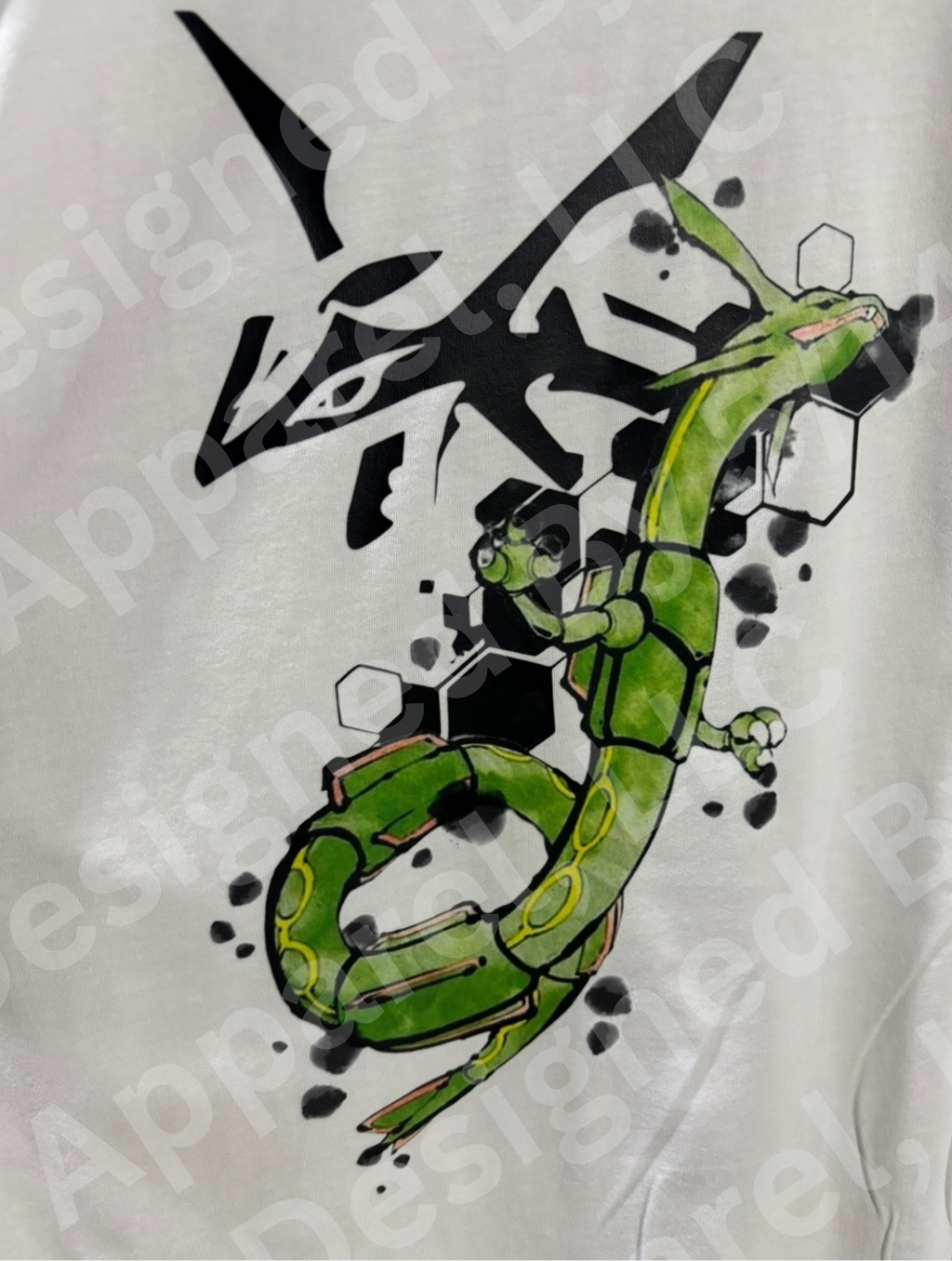 Close-up of Rayquaza watercolor graphic on white tee — Rayquaza in green watercolor with black geometric hexagon shapes design by 5/14 Apparel