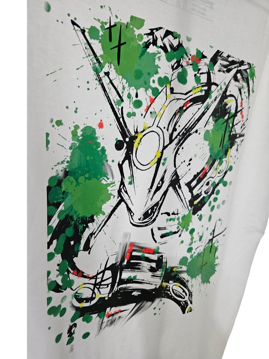 Close-up of Rayquaza splat sketch graphic on white tee — bold green paint splatter and sketch art design by 5/14 Apparel
