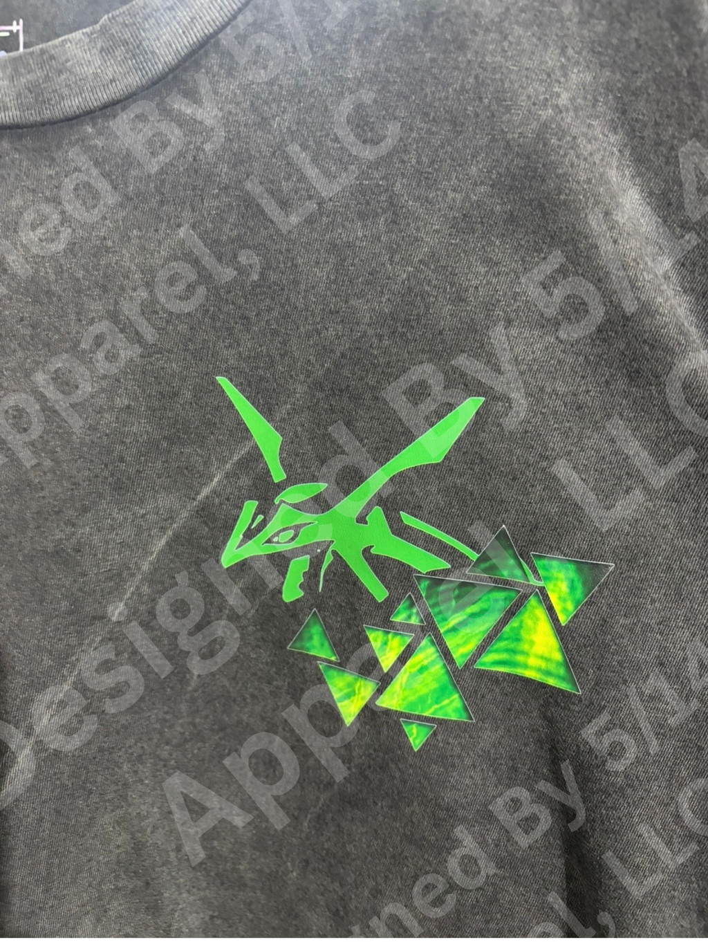 Close-up of Rayquaza graphic on vintage tee — Rayquaza in green with storm cloud detail design by 5/14 Apparel