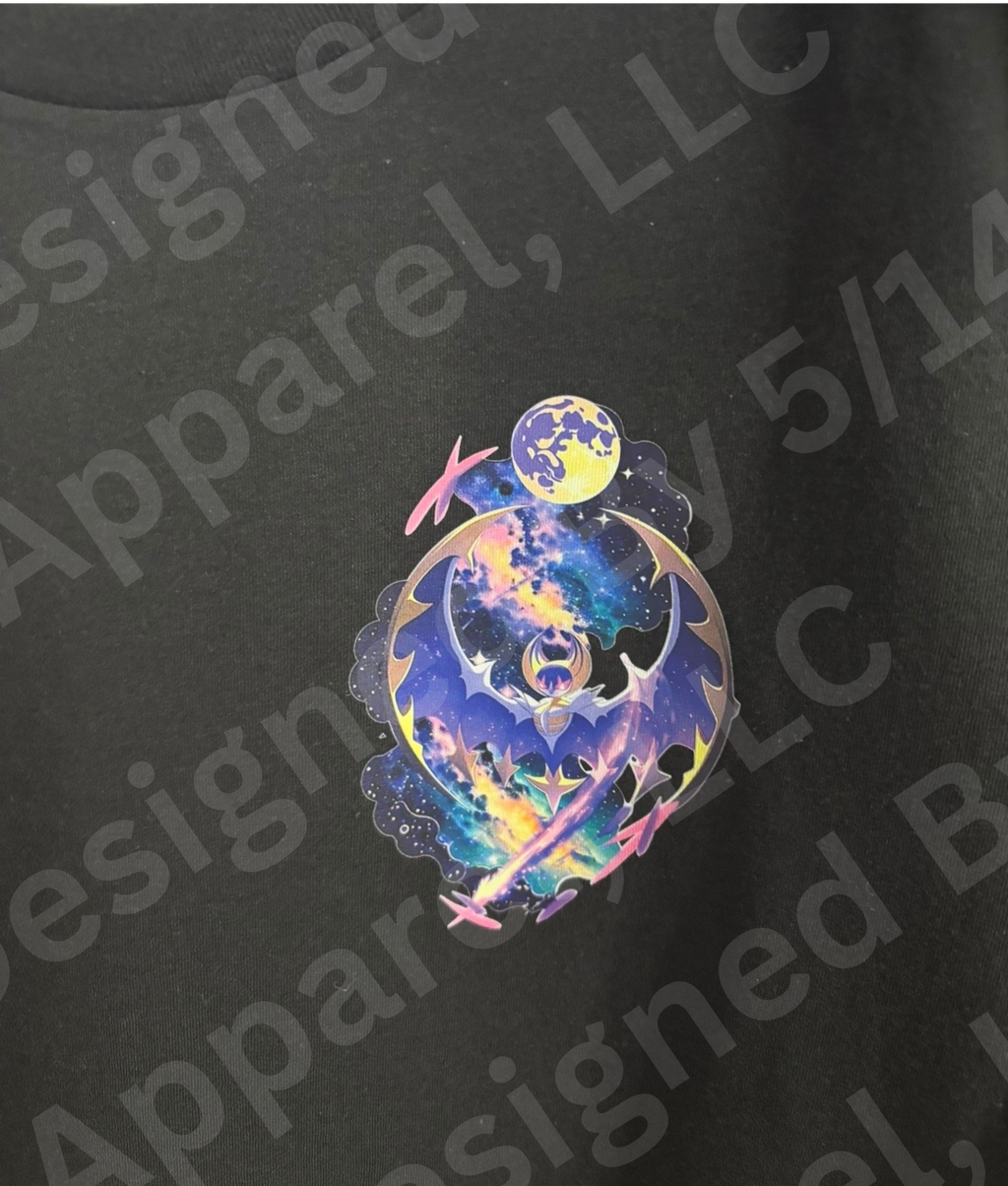 Close-up of Lunala galaxy graphic on black tee — Lunala in blue and purple galaxy with full moon and pink Clefairy silhouettes design by 5/14 Apparel